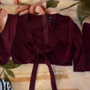 Burgundy colored open from the chest area